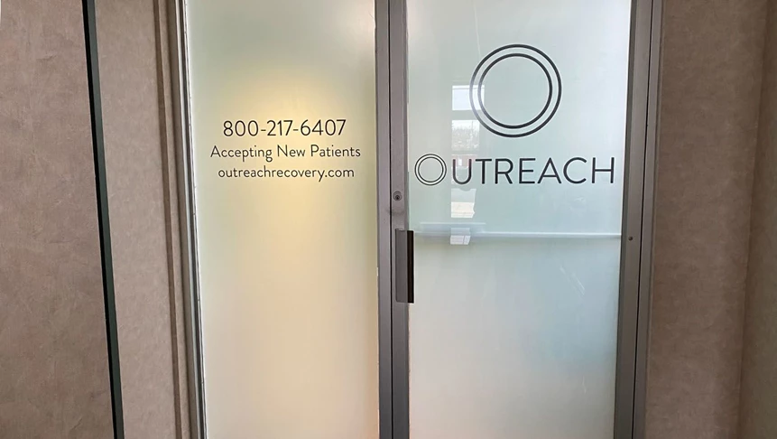 Frosted vinyl covers Outreachs glass doors to offer privacy for patients.