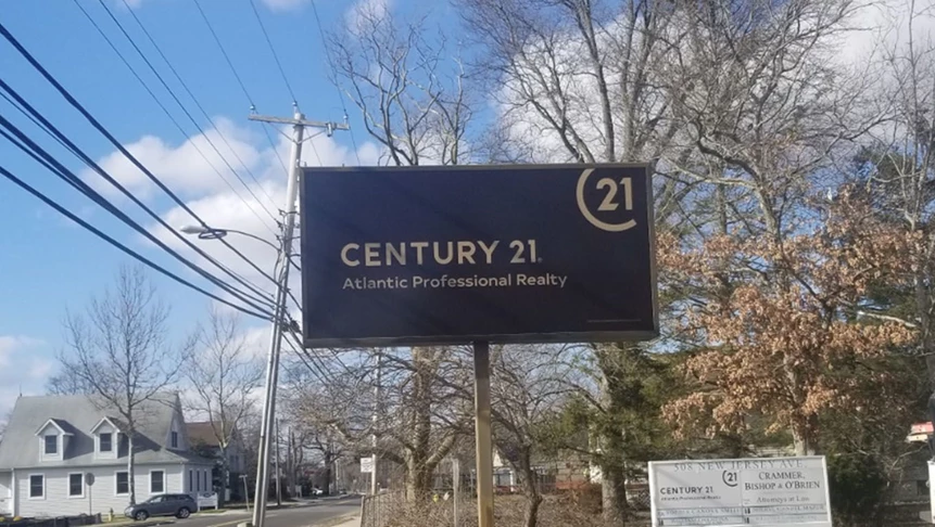 Pylon signage with vinyl laid on top for Century 21s lightbox sign.