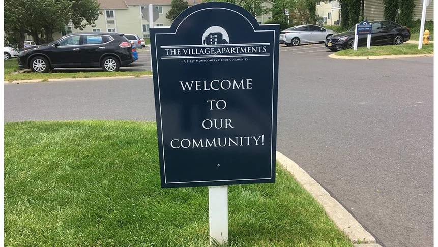 Parking lot signage for The Village Apartments