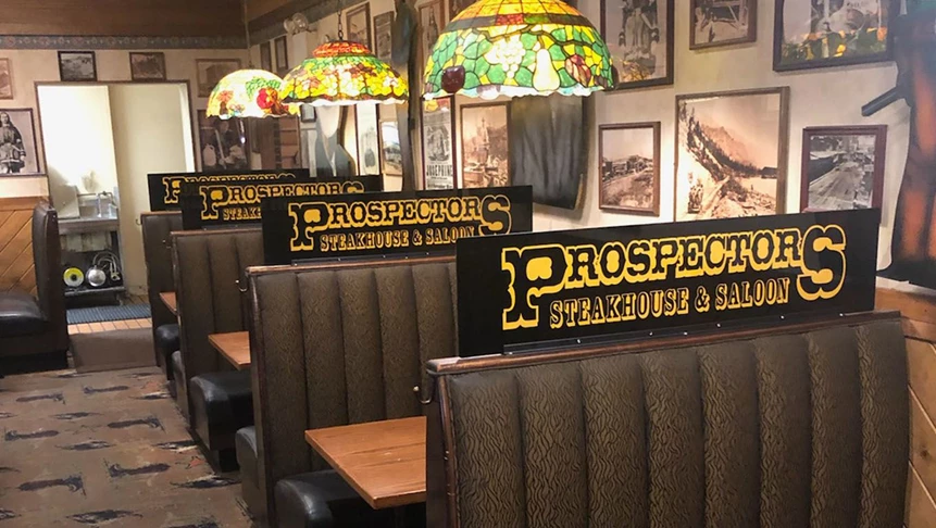 Booth screens for Prospectors help their patrons enjoy a safe and healthy dining experience by preventing the spread of germs.