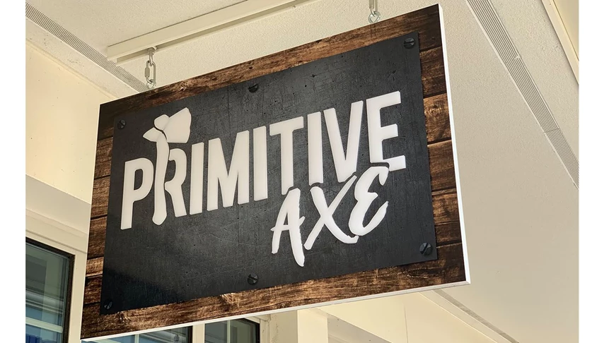 Hanging PVC sign custom made for one of Primitive Axes locations.