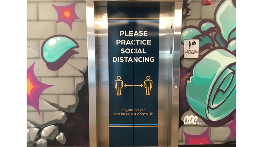 Social distancing elevator graphics for The Stars Groups office.