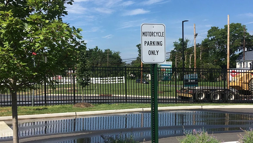 Designated parking lot signage printed and installed.