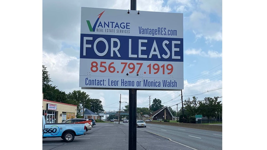 A spin on the traditional post & panel sign. Vantage was looking to mount their property leasing sign on a lightpost.