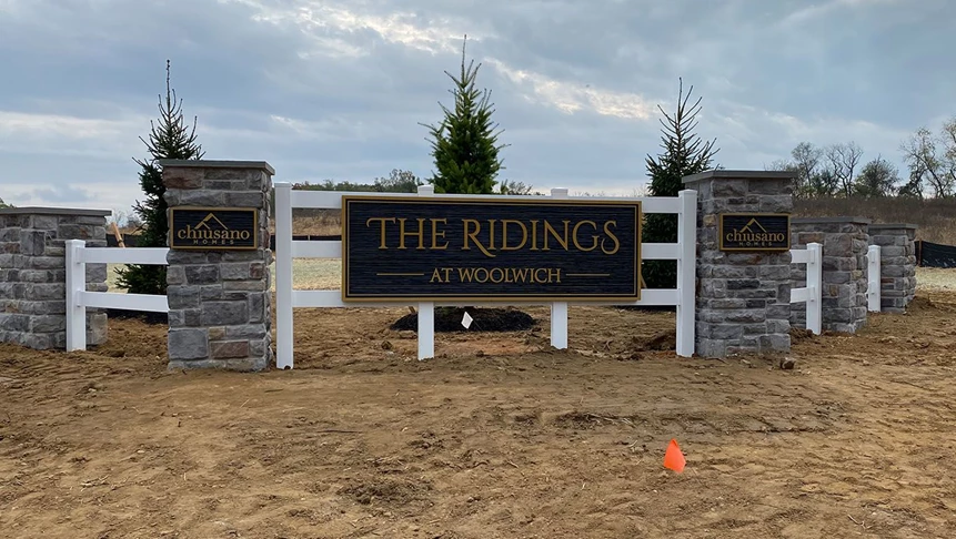 Carved signs for C&Cs development The Ridings.
