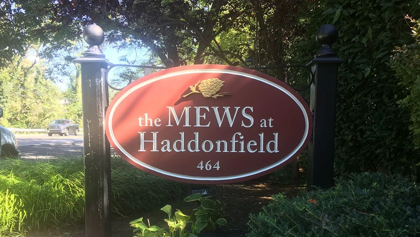 The Mews at Haddonfield wanted to make the lettering on their sign easier to read. We diligently re-painted the lettering from dark gold to a light tan color.